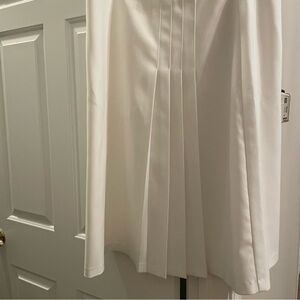 Brand new white skirt, famous  European designer. Can be wornn with any jacket